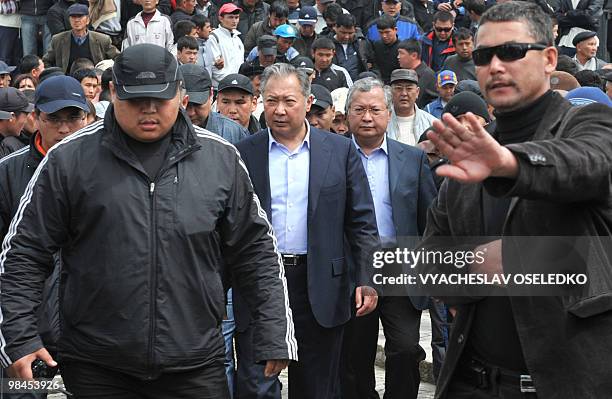 Ousted Kyrgyz President Kurmanbek Bakiyev , surrounded by his bodyguards, walks with his supporters during a rally in Jalal-Abad some 600 km outside...