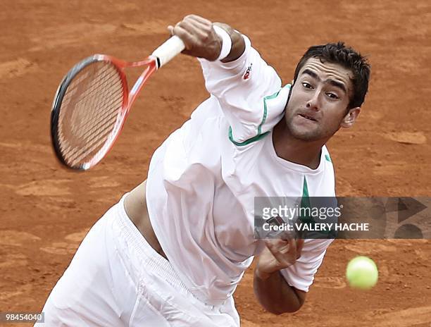 Croatian player Marin Cilic serves to his Russian opponent Igor Andreev during their Monte-Carlo ATP Masters Series Tournament tennis match, on April...