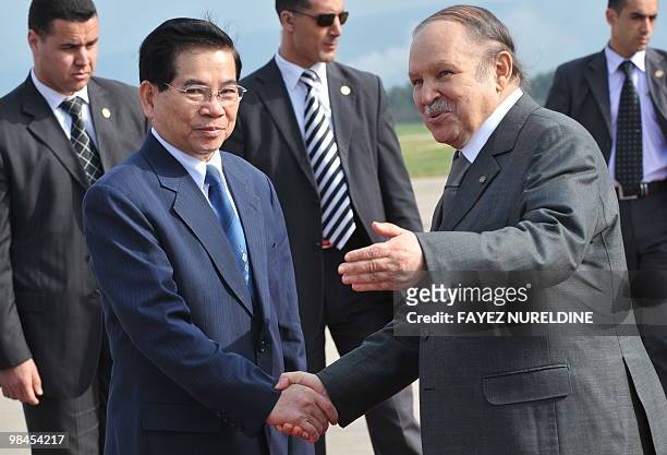 Algerian President Abdelaziz Bouteflika shakes hands to his Vietnamese counterpart Nguyen Minh Triet during a welcoming ceremony at Houari Boumediene...