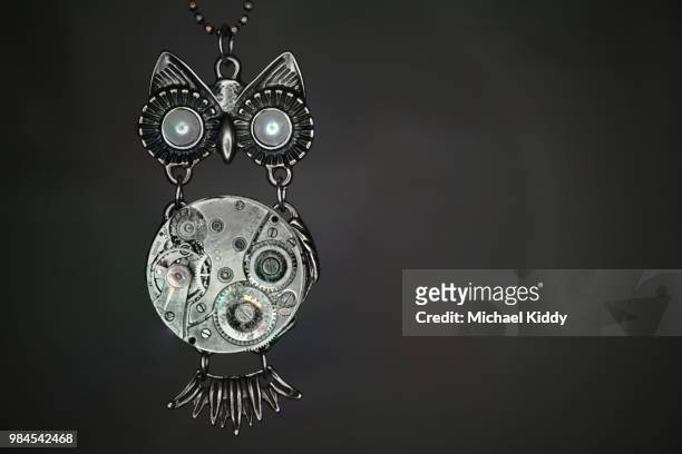 clockwork owl. - circle pendant stock pictures, royalty-free photos & images