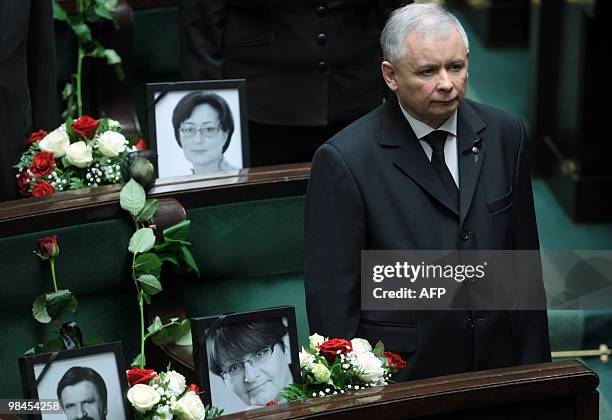 Jaroslaw Kaczynski , twin brother of late Polish President Lech Kaczynski, stands next to empty seats with pictures of victims of last weekends...