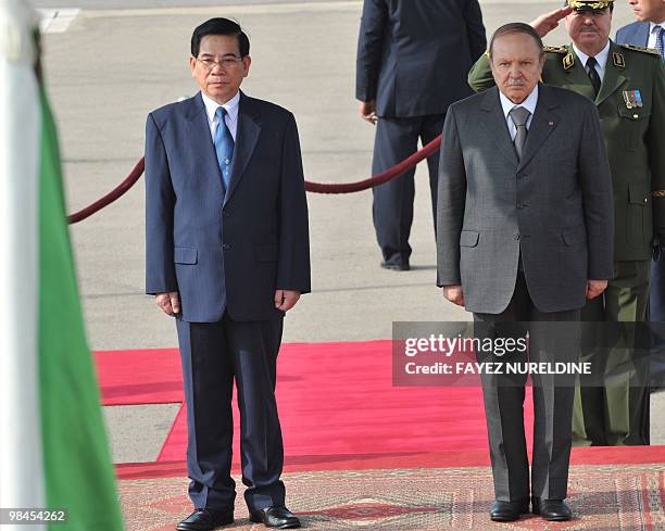 Algerian President Abdelaziz Bouteflika stands next to his Vietnamese counterpart Nguyen Minh Triet during a welcoming ceremony at Houari Boumediene...