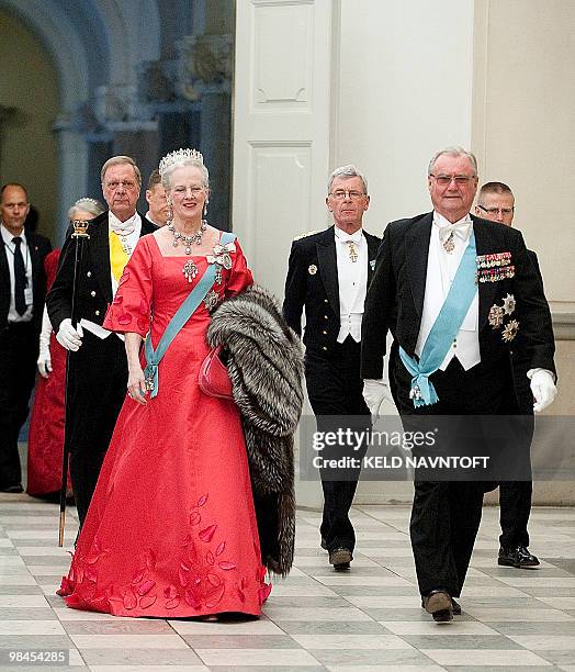 Danish Queen Margrethe and Prince Consort Henrik arrives at Christiansborg Palace in central Copenhagen on April 13, 2010 for the official dinner...