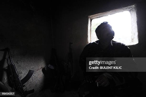 Village guard rests in his cabin on April 10, 2010 in the mountainous southeastern city of Siirt. The village guards, made up of Kurdish peasants who...