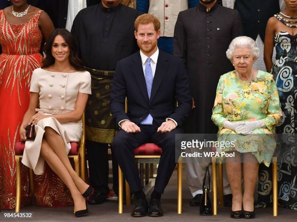 Meghan, Duchess of Sussex, Prince Harry, Duke of Sussex and Queen Elizabeth II at the Queen's Young Leaders Awards Ceremony at Buckingham Palace on...