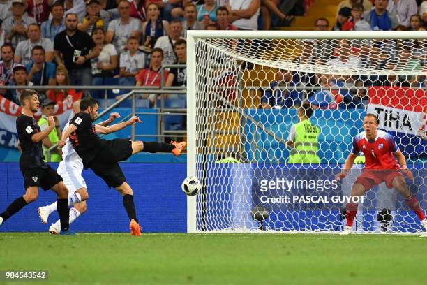 Croatia's midfielder Milan Badelj scores the opening goal during the Russia 2018 World Cup Group D football match between Iceland and Croatia at the...