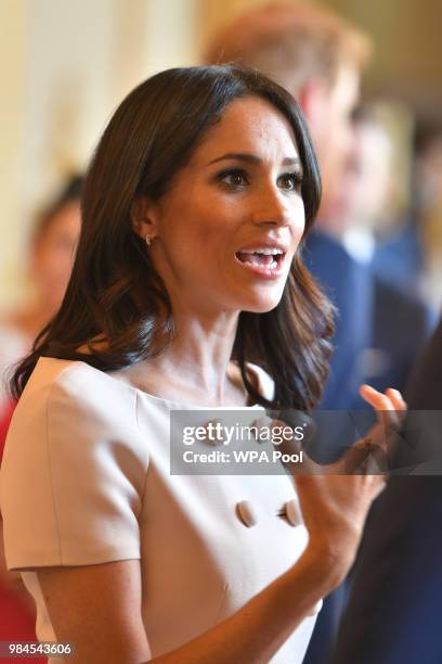 Meghan, Duchess of Sussex meets guests at the Queen's Young Leaders Awards Ceremony at Buckingham Palace on June 26, 2018 in London, England. The...