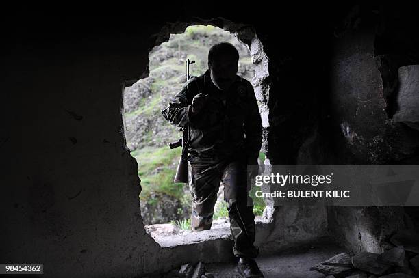 Village guard enters his cabin on April 10, 2010 in the mountainous southeastern city of Siirt. The village guards, made up of Kurdish peasants who...