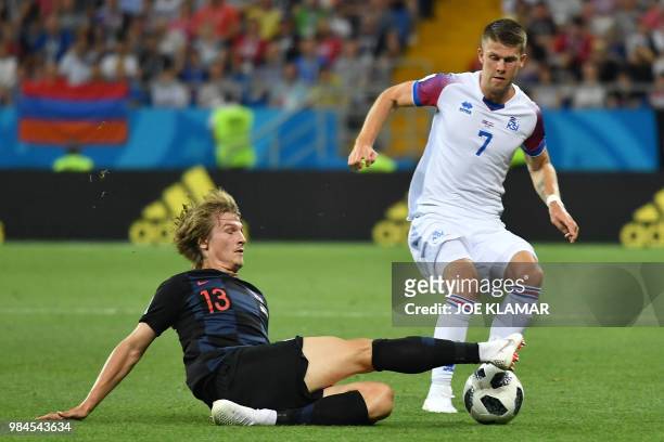 Croatia's defender Tin Jedvaj vies with Iceland's midfielder Johann Gudmundsson during the Russia 2018 World Cup Group D football match between...