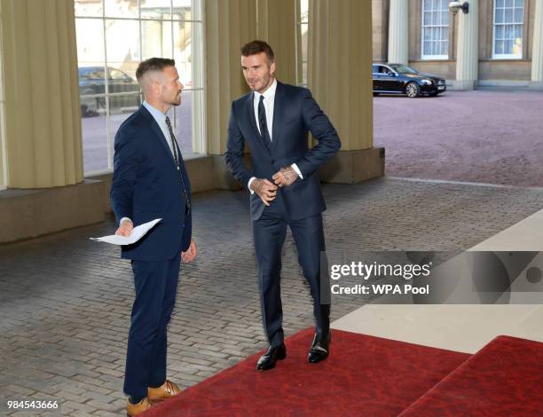 David Beckham attends the Queen's Young Leaders Award Ceremony as Queen Elizabeth II accompanied by Prince Harry, Duke of Sussex and Meghan, Duchess...