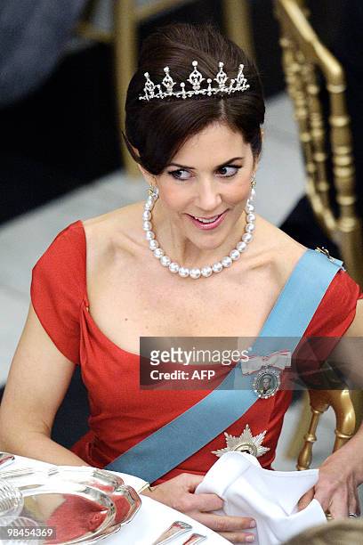 Danish Crown Princess Mary looks on at Christiansborg Palace in central Copenhagen on April 13, 2010 during the official dinner party in celebration...