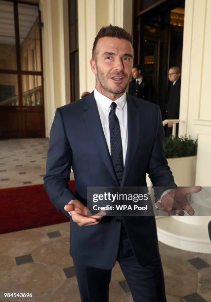 David Beckham attends the Queen's Young Leaders Award Ceremony as Queen Elizabeth II accompanied by Prince Harry, Duke of Sussex and Meghan, Duchess...