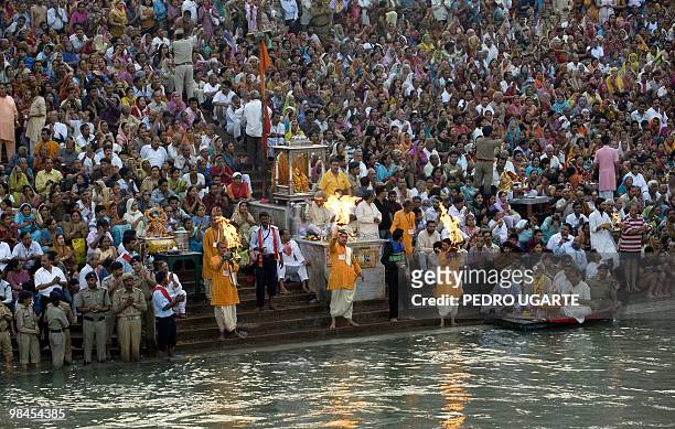 Hindu devotees pray on the banks of river Ganges during the Kumbh Mela festival on April 13, 2010 in Haridwar.The Kumbh Mela, world's largest...
