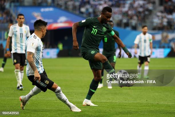 John Obi Mikel of Nigeria controls the ball under pressure from Enzo Perez of Argentina during the 2018 FIFA World Cup Russia group D match between...