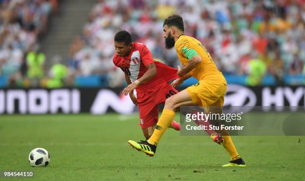 Australia captain Mile Jedinak fouls Edison Flores of Peru during the 2018 FIFA World Cup Russia group C match between Australia and Peru at Fisht...