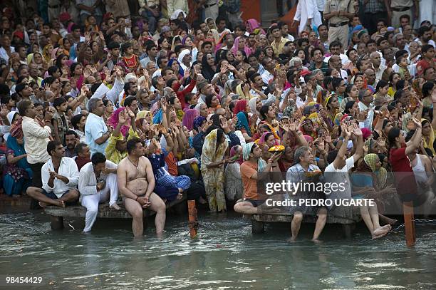 Hindu devotees pray on the banks of river Ganges during the Kumbh Mela festival on April 13, 2010 in Haridwar.The Kumbh Mela, world's largest...