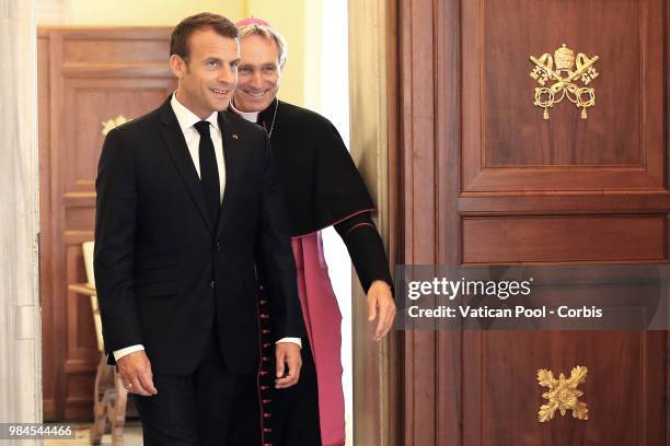 Pope Francis meets French President Emmanuel Macron and his wife Brigitte Macron during an audience at the Vatican, on June 26, 2018 in Vatican City,...