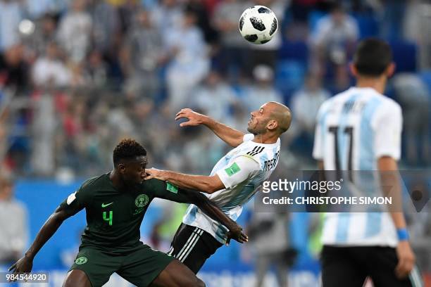 Argentina's midfielder Javier Mascherano vies for the ball with Nigeria's midfielder Onyinye Ndidi during the Russia 2018 World Cup Group D football...