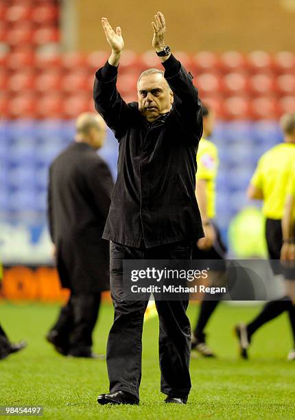 Portsmouth manager Avram Grant salutes the fans after the Barclays Premier League match between Wigan Athletic and Portsmouth at the JJB Stadium on...