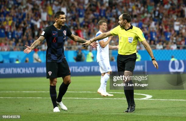 Dejan Lovren of Croatia confronts referee Antonio Mateu after he awards Iceland a penalty for a Dejan Lovren of Croatia hand ball inside the penalty...