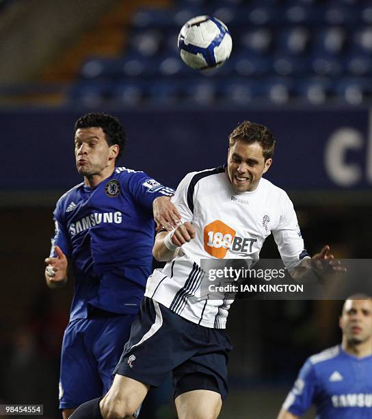 Bolton Wanderers' Swedish player Johan Elmander challenges Chelsea's German footballer Michael Ballack during their Premier League football match at...