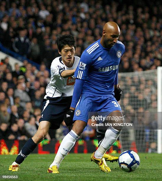 Bolton Wanderers' South Korean player Chung-Yong Lee defends against Chelsea's French footballer Nicolas Anelka during their Premier League football...