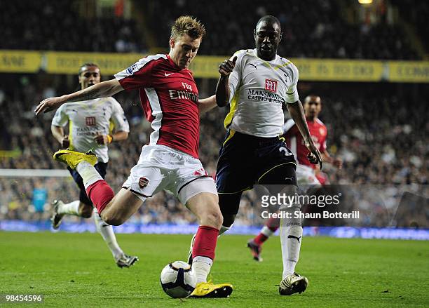 Nicklas Bendtner of Arsenal is challenged by Ledley King of Tottenham Hotspur during the Barclays Premier League match between Tottenham Hotspur and...