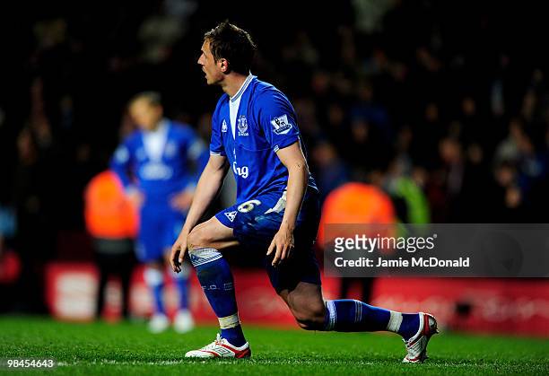 Phil Jagielka of Everton reacts after scoring an own goal during the Barclays Premier League match between Aston Villa and Everton at Villa Park on...