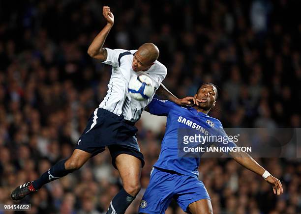 Chelsea's Ivory Coast footballer Didier Drogba vies for the ball with Bolton Wanderers' Zat Knoght during their Premier League football match at...
