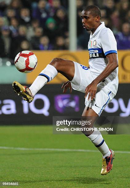 Inter Milan's Cameroonian forward Samuel Eto'o controls the ball and scores during their Italian semifinal second leg football match Florence against...