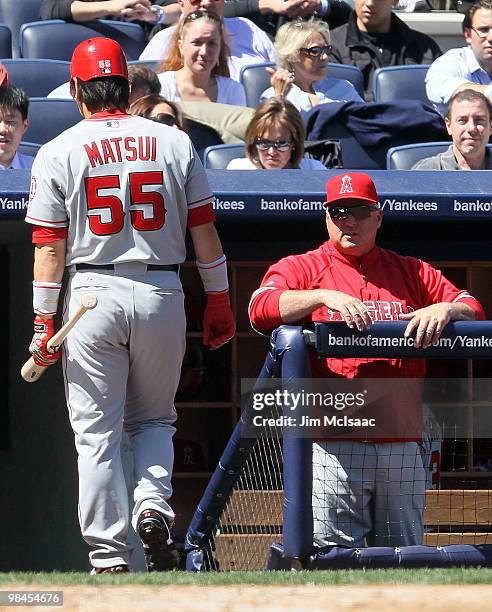 Hideki Matsui of the Los Angeles Angels of Anaheim walks back to the dugout after striking out in the third inning against the New York Yankees as...