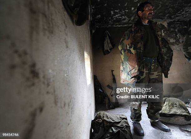 Village guard stands in his cabin on April 10, 2010 in the mountainous southeastern city of Siirt. The village guards, made up of Kurdish peasants...
