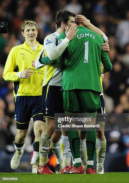 Gareth Bale of Tottenham Hotspur hugs goalkeeper Heurelho Gomes after the Barclays Premier League match between Tottenham Hotspur and Arsenal at...