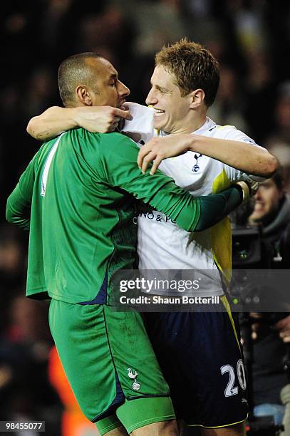 Michael Dawson of Tottenham Hotspur hugs goalkeeper Heurelho Gomes after the Barclays Premier League match between Tottenham Hotspur and Arsenal at...