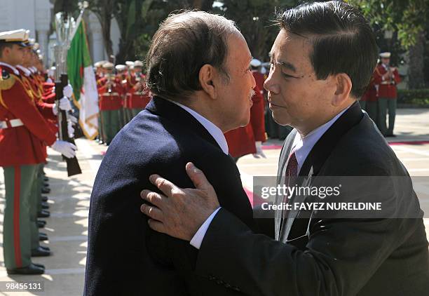 Algerian President Abdelaziz Bouteflika greets his Vietnamese counterpart Nguyen Minh Triet on April 14, 2010 before their meeting in Algiers. Triet...