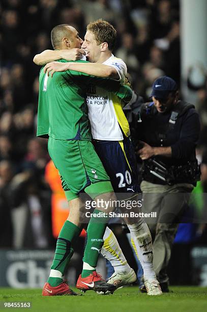 Michael Dawson of Tottenham Hotspur hugs goalkeeper Heurelho Gomes after the Barclays Premier League match between Tottenham Hotspur and Arsenal at...