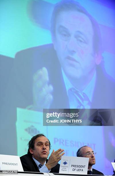 President Michel Platini speaks next to Ramon Luis Valcarcel Siso, first vice-president of the Committee of Regions during a discussion about the...