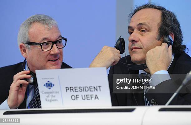 President Michel Platini and Ramon Luis Valcarcel Siso, first vice-president of the Committee of Regions, attend a meeting about the role of football...