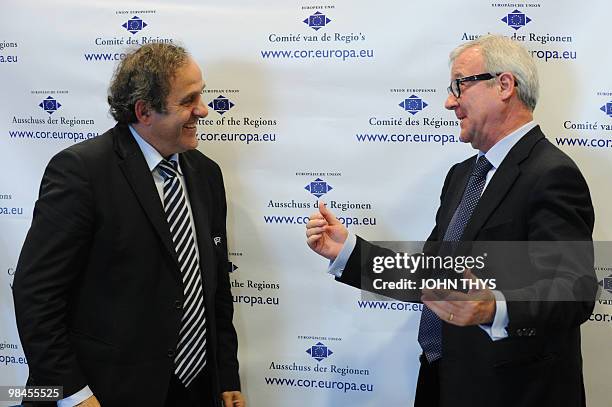 President Michel Platini speaks with Ramon Luis Valcarcel Siso, first vice-president of the Committee of Regions, during ameeting about the role of...