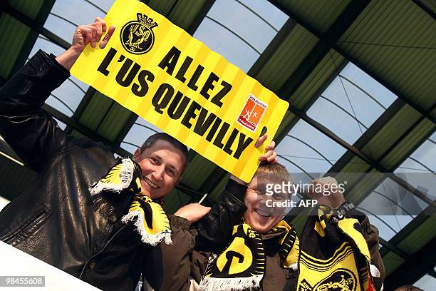 Supporters of French Fourth division Quevilly football club wave on April 14, 2010 in Caen, northwestern France, before attending the French Cup...