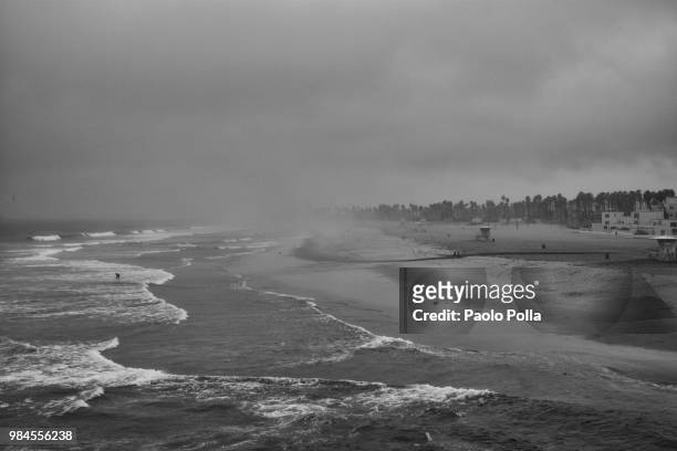 stormy huntington beach - polla stock pictures, royalty-free photos & images
