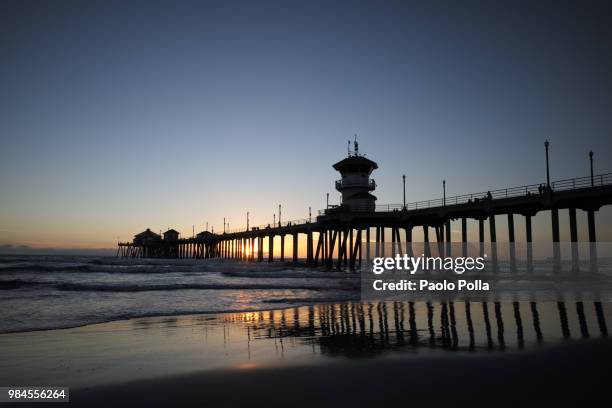 sunset huntington beach pier - polla stock pictures, royalty-free photos & images