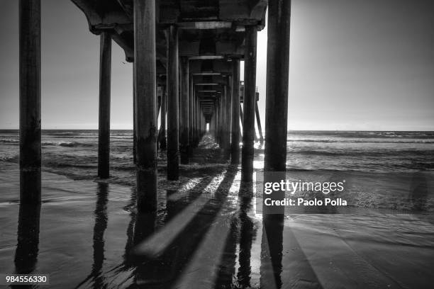 huntington beach pier b&w - polla stock pictures, royalty-free photos & images