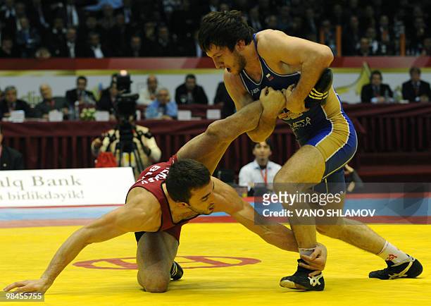 Kiril Stoychev Terziev of Bulgaria competes with Denis Tsarguish of Russia during the Freestyle Wrestling 74kg gold medal match at the Senior...