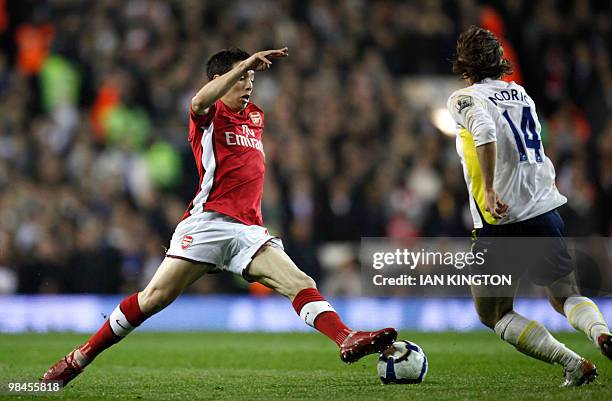 Arsenal's French player Samir Nasri controls the ball under pressure from Tottenham Hotspurs Croatian player Luka Modric during a Premier League...