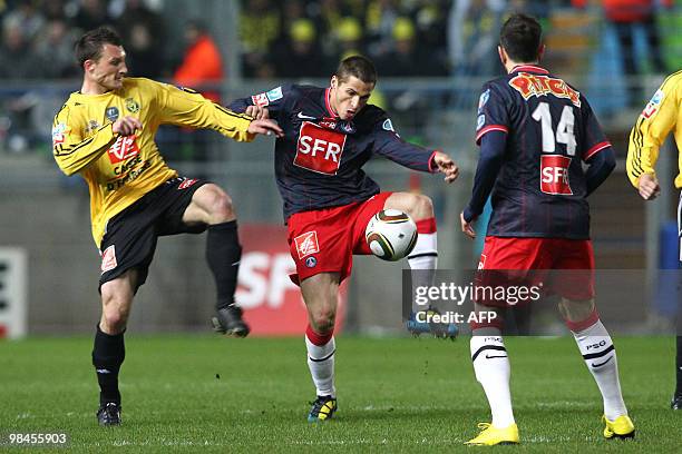 Quevilly's midfielder Sebastien Vaugeois vies with Paris' midfielder Jeremy Clement during their French Cup football match Quevilly vs Paris...