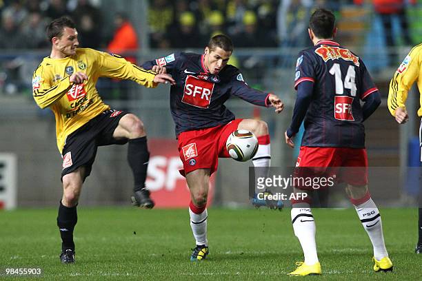 Quevilly's midfielder Sebastien Vaugeois vies with Paris' midfielder Jeremy Clement during their French Cup football match Quevilly vs Paris...