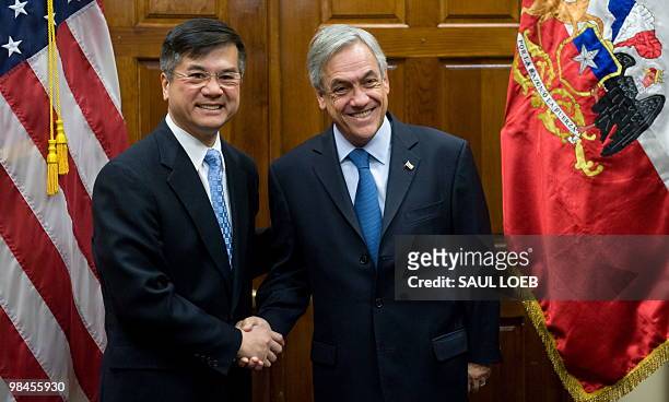Secretary of Commerce Gary Locke greets Chile's President Sebastian Pinera during meetings at the Department of Commerce in Washington, DC, April 12,...