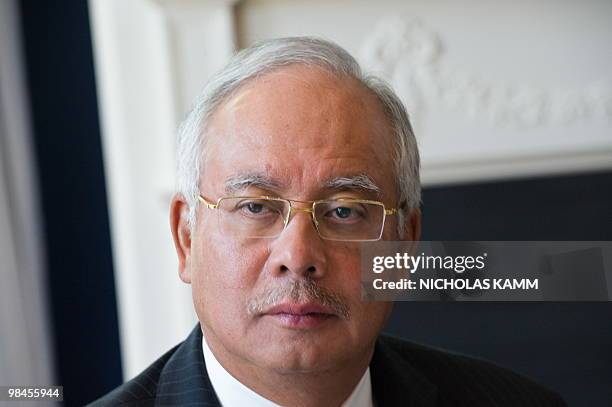 Malaysian Prime Minister Najib Razak listens to US Vice President Joe Biden address leaders at the Naval Observatory, the vice president's residence,...