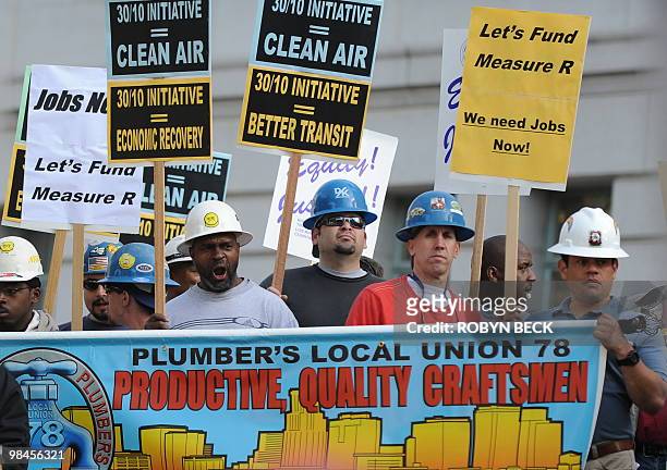 Union building trade workers and their supporters stage a rally to call for the release of federal stimulus funds to save local jobs, on the steps of...